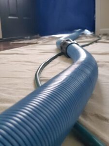 Blue carpet cleaning vacuum host